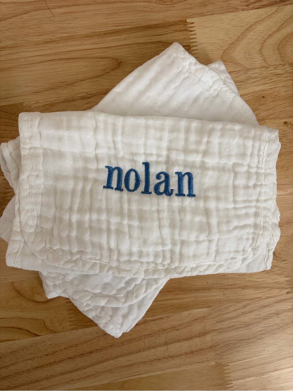 Personalized White Baby Bib with Blue Embroidered Name